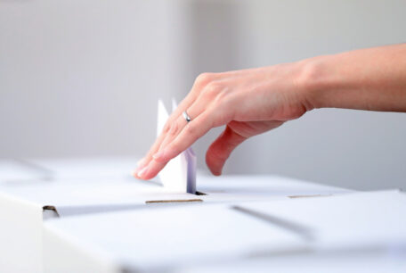 A woman casting a ballot as she votes in the local elections.